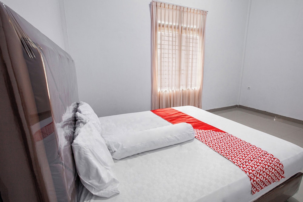 oyo 92587 homestay romauli kampung radja