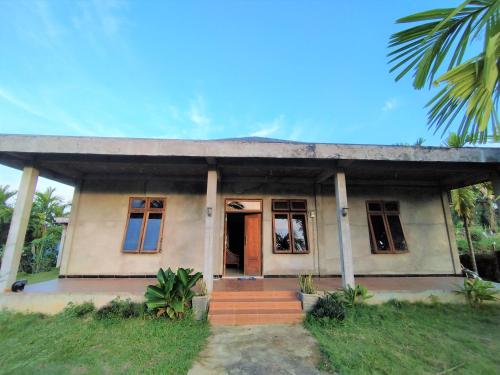 oyo 92587 homestay romauli kampung radja