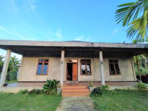 oyo 92587 homestay romauli kampung radja