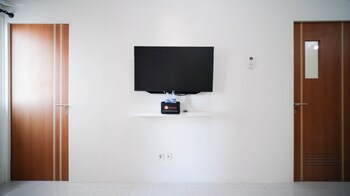 cozy living and tidy 2br at puncak dharmahusada apartment