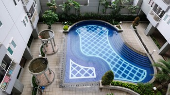 cozy living and tidy 2br at puncak dharmahusada apartment