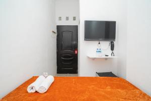 reddoorz aralia harapan indah