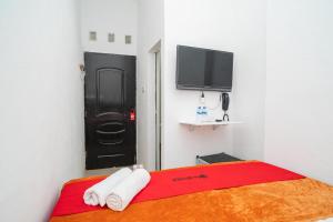 reddoorz aralia harapan indah