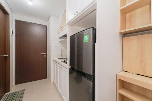 redliving apartemen transpark juanda frams properti tower jade with netflix