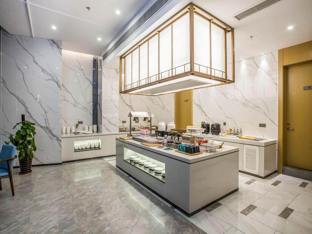 magnotel business zhenjiang south railway station greenland square