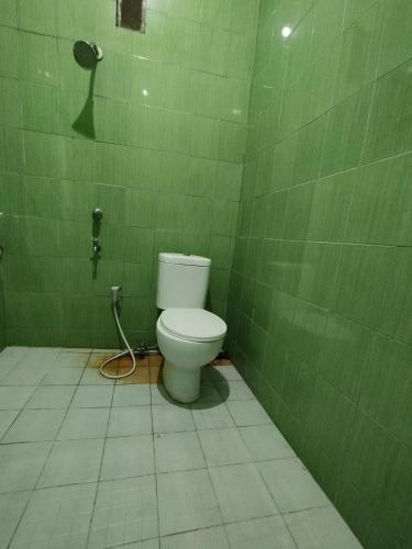 spot on 93001 losmen arkansas syariah