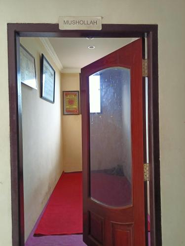 spot on 93001 losmen arkansas syariah