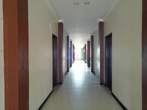 spot on 93001 losmen arkansas syariah