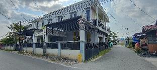 spot on 93001 losmen arkansas syariah