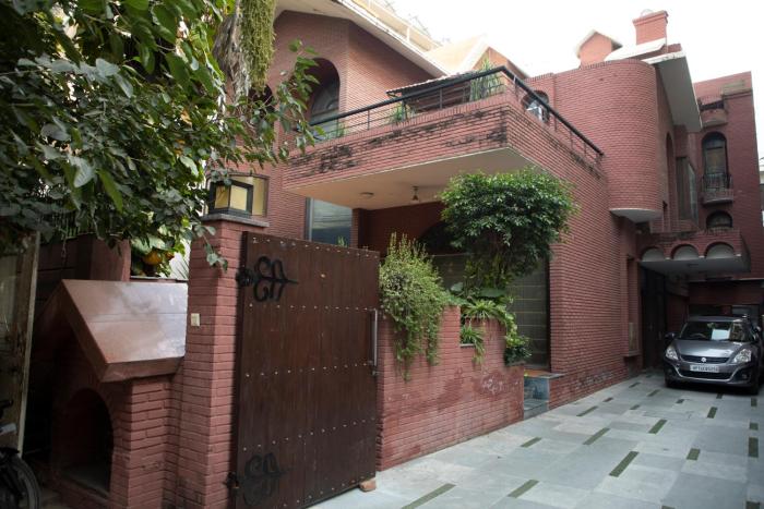 red brick home by earthaa escapes