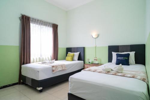 urbanview hotel de kopen malang
