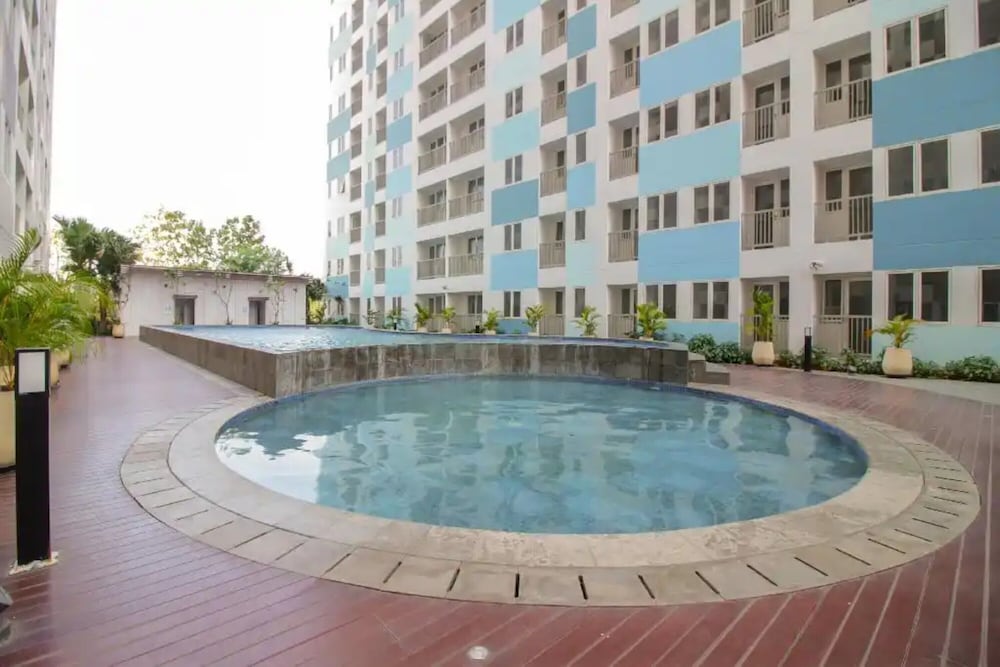 oyo 93386 apartemen grand sentraland by mira