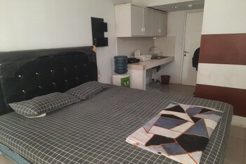 oyo 93386 apartemen grand sentraland by mira