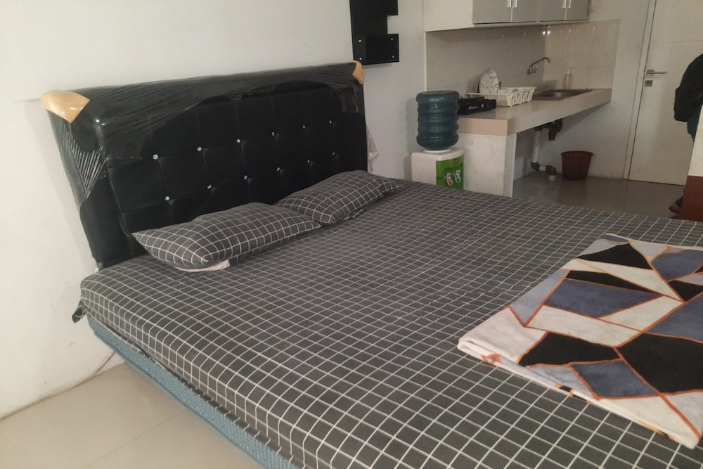 oyo 93386 apartemen grand sentraland by mira