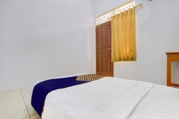 spot on 93988 guest house wijaya syariah