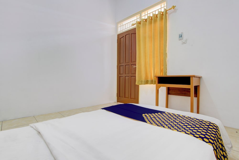 spot on 93988 guest house wijaya syariah
