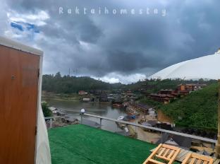 rakthai homestay view of the lake and mountains not far from the water