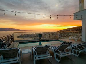 sunset shoreline saranda hotel