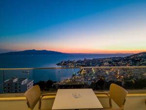 sunset shoreline saranda hotel