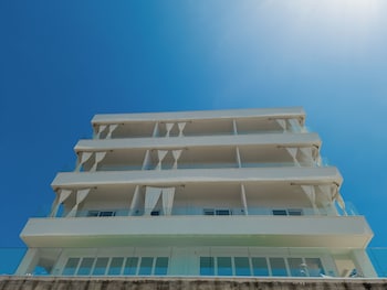 sunset shoreline saranda hotel