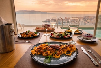 sunset shoreline saranda hotel