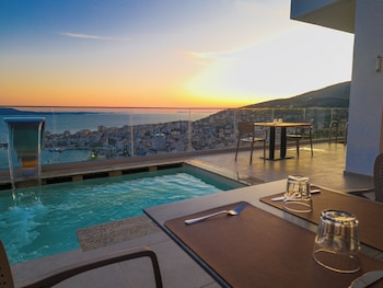 sunset shoreline saranda hotel