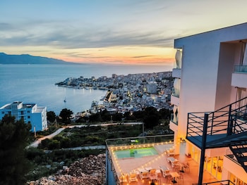 sunset shoreline saranda hotel