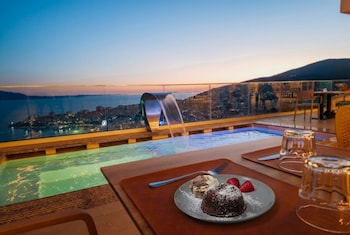 sunset shoreline saranda hotel