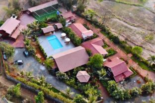 crimson bricks and woods resort cottages karjat