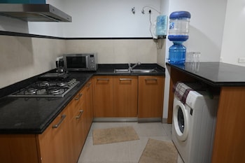 luxurious 1bhk apartment in gurgaon with shared pool and bbq area