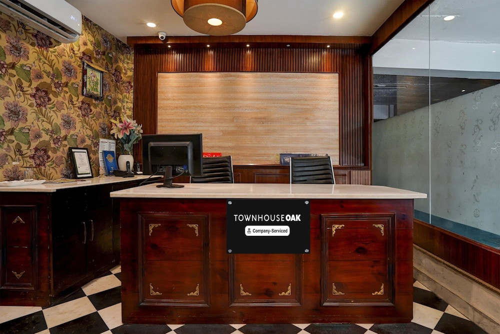 elegant stays with rooftop restro and hill view