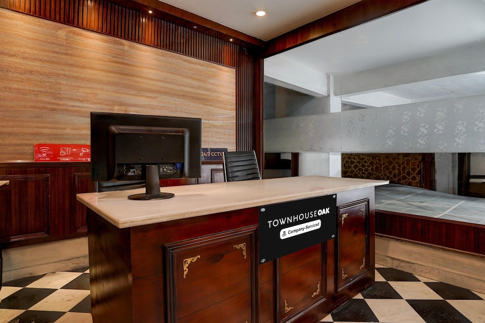 elegant stays with rooftop restro and hill view