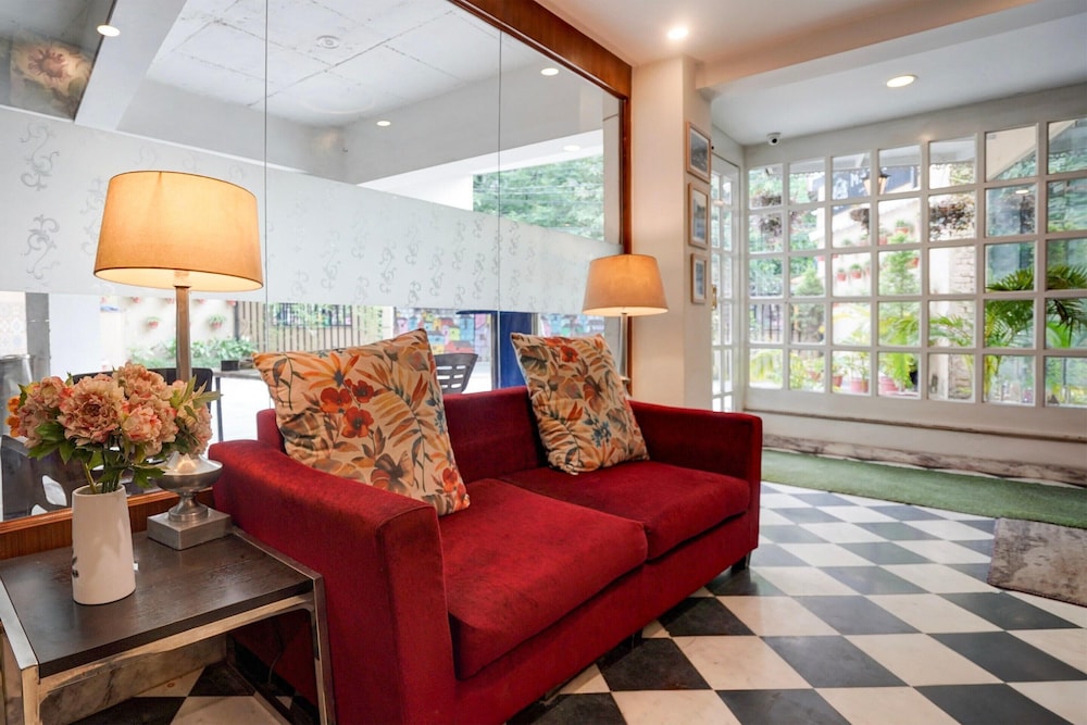 elegant stays with rooftop restro and hill view