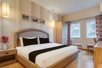 elegant stays with rooftop restro and hill view