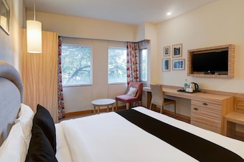 elegant stays with rooftop restro and hill view