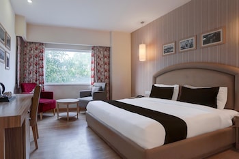 elegant stays with rooftop restro and hill view