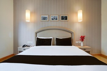 elegant stays with rooftop restro and hill view