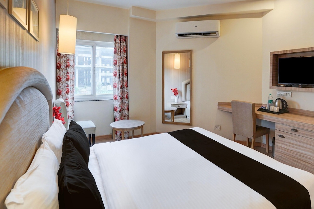 elegant stays with rooftop restro and hill view