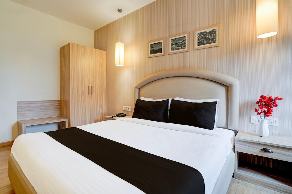 elegant stays with rooftop restro and hill view