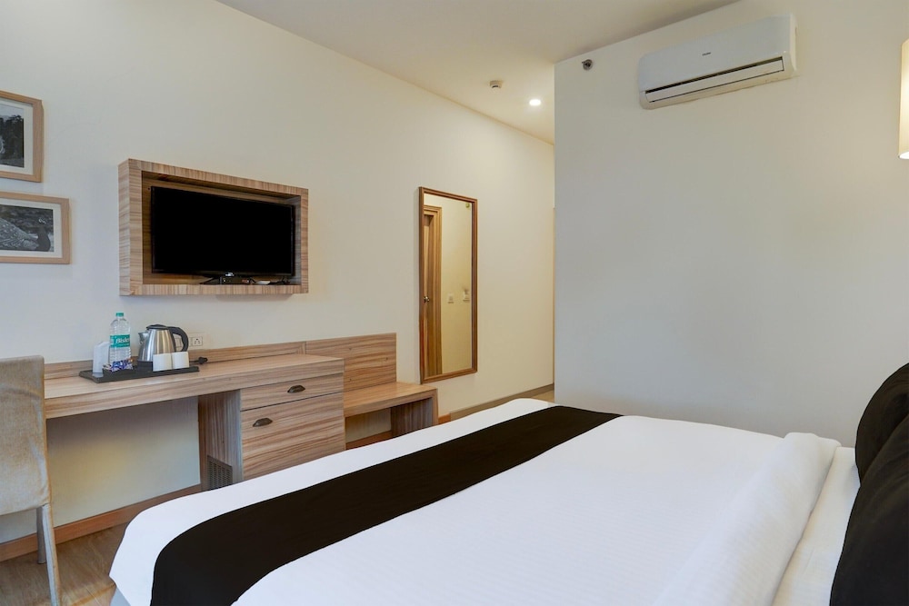 elegant stays with rooftop restro and hill view