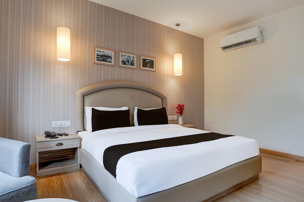 elegant stays with rooftop restro and hill view