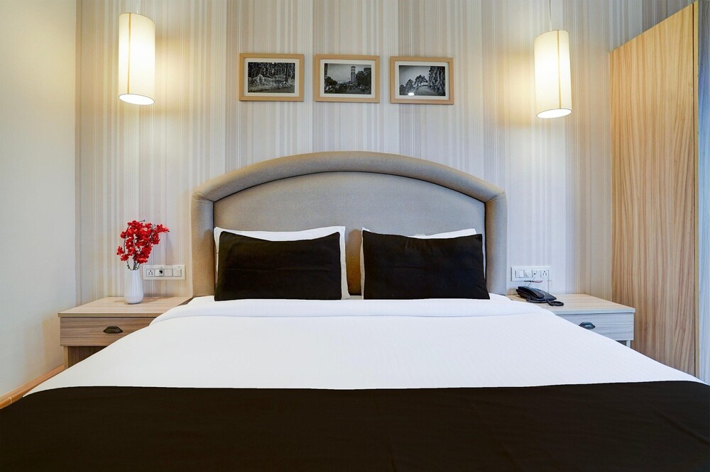 elegant stays with rooftop restro and hill view