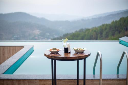 spellmount himalayan view infinity pool resort in kausani