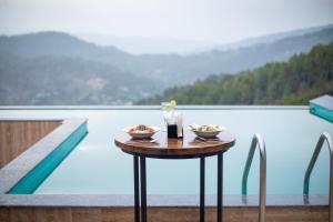spellmount himalayan view infinity pool resort in kausani