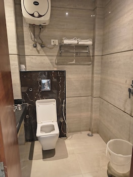 hotel aman suites at igi by arch group
