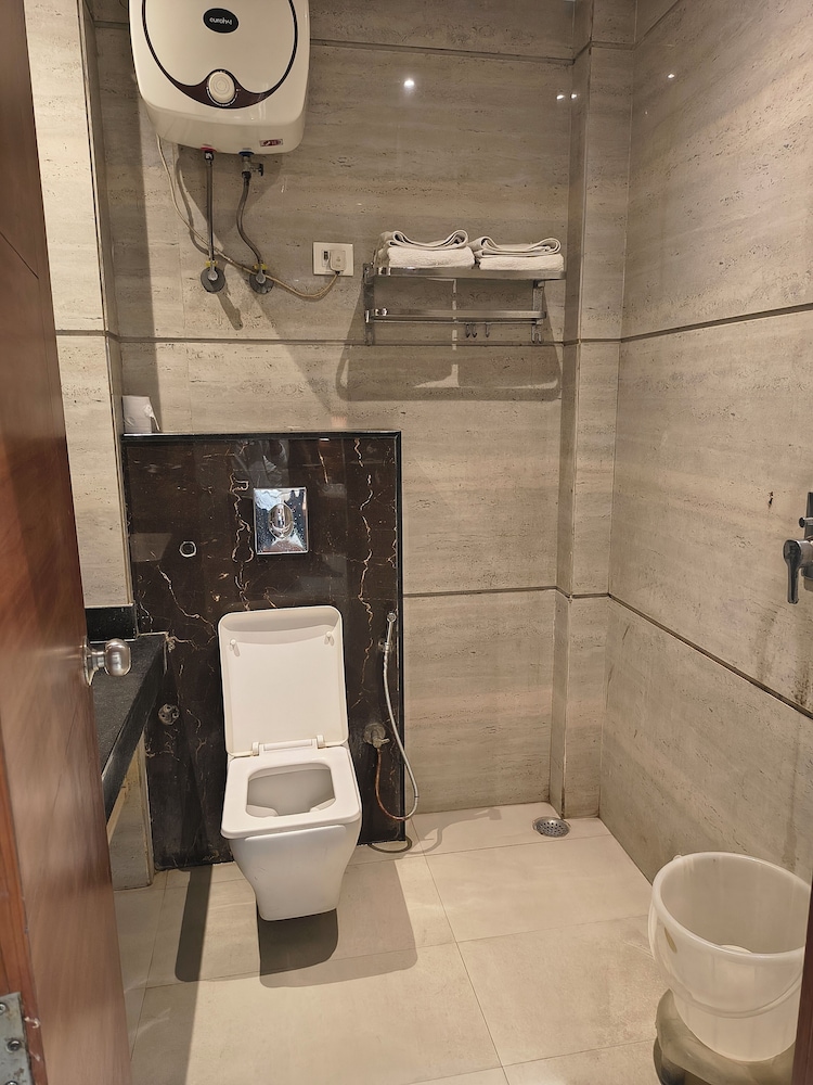 hotel aman suites at igi by arch group