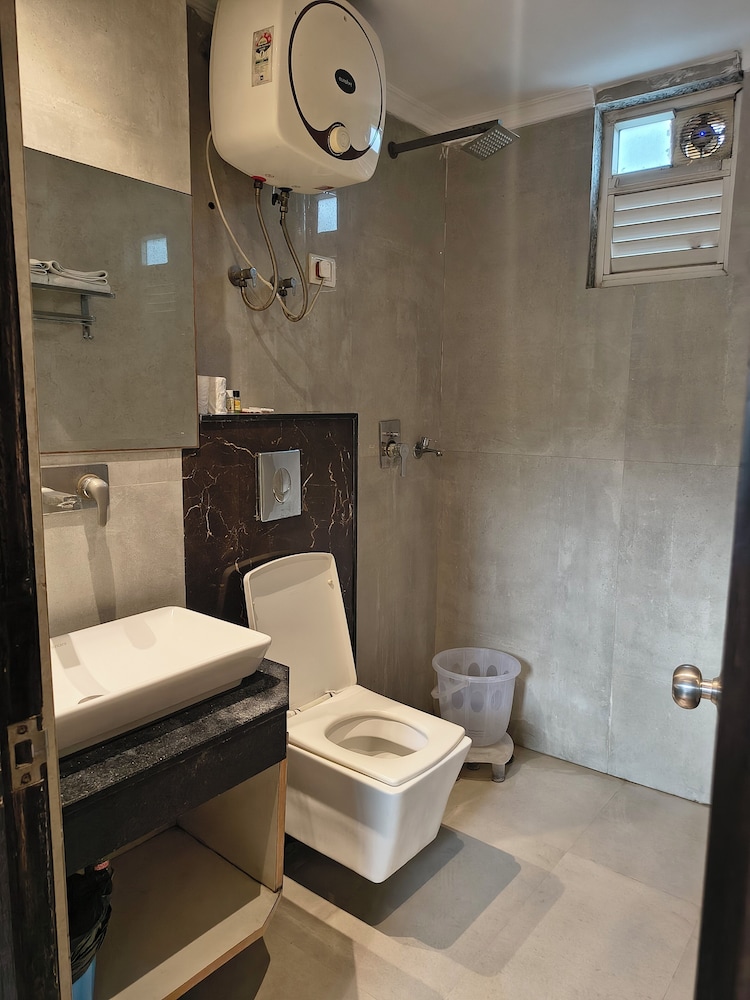 hotel aman suites at igi by arch group