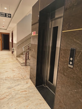 hotel aman suites at igi by arch group