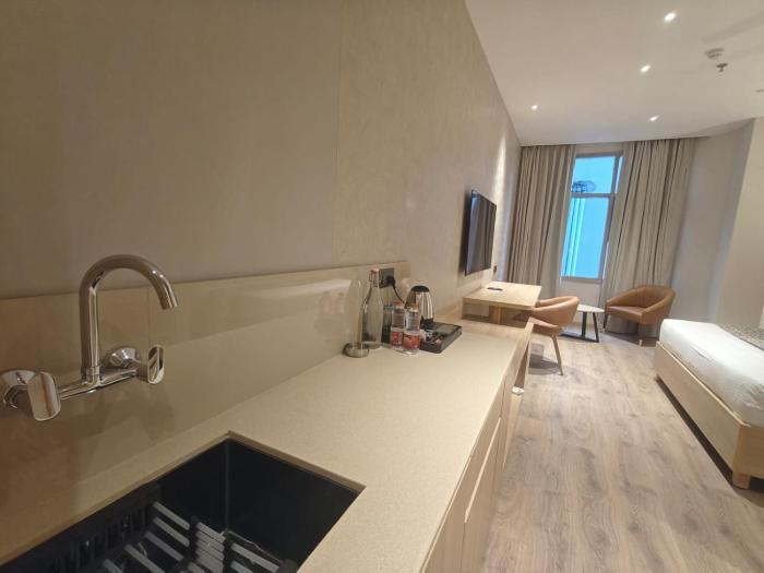 hotel bluestone prime nehru place by the cosy hotels