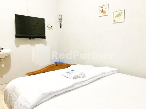 reddoorz syariah de kostmarto uty